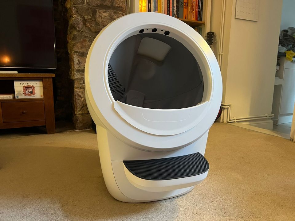 White self-cleaning litter box.