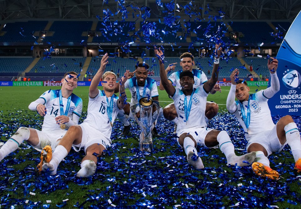 England's under-21 football team celebrates their championship win.