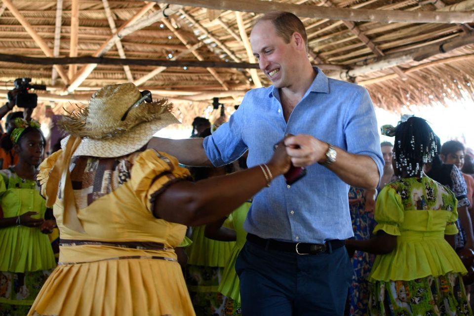 Prince William dancing with Garifuna women in Belize.