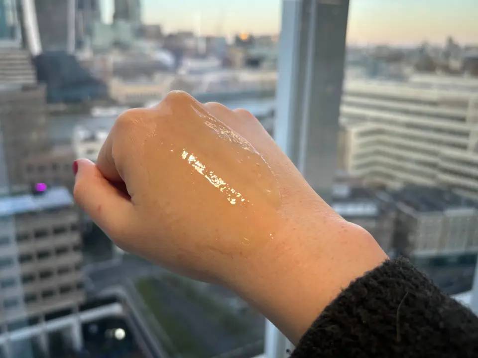 Hand with cleansing oil.