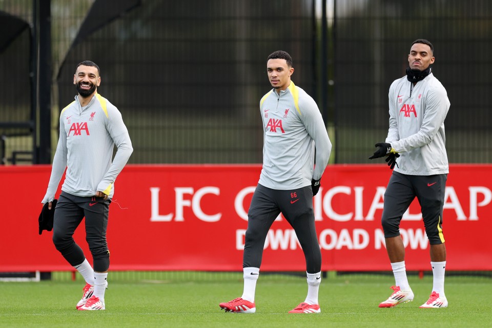 Mohamed Salah, Trent Alexander-Arnold, and Ryan Gravenberch of Liverpool at a training session.
