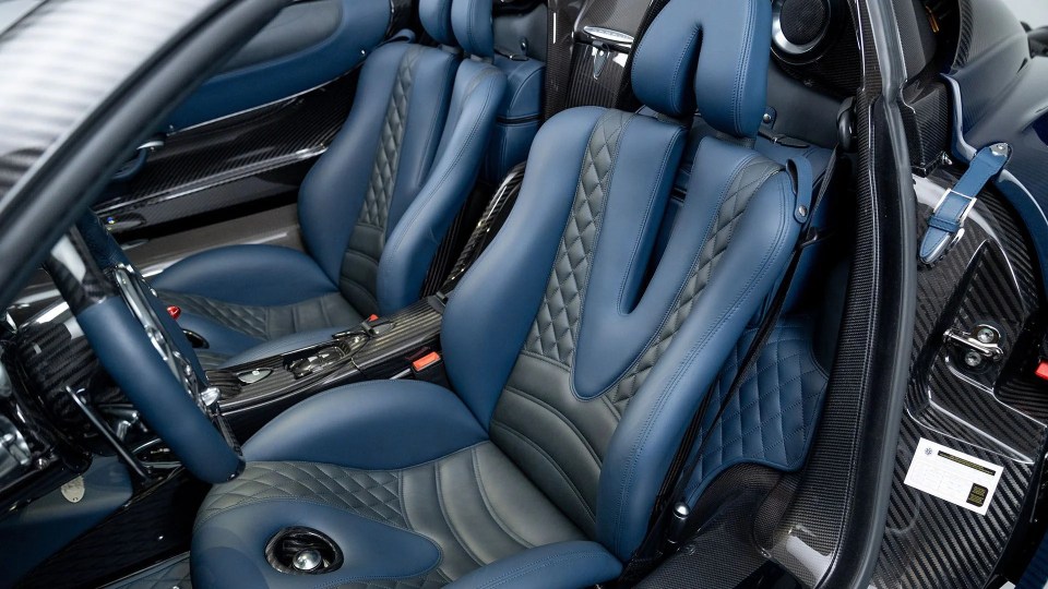 Interior of a blue and gray Pagani Huayra Roadster.
