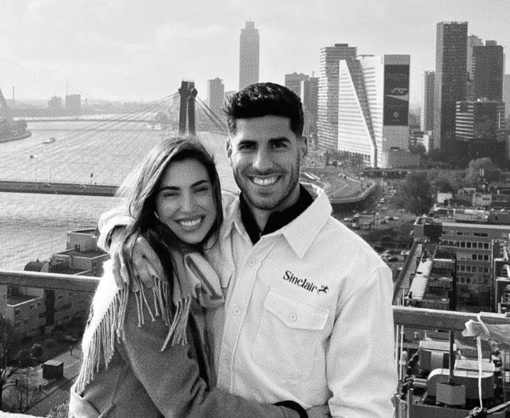 Black and white photo of Marco Ascensio and Sandra Garal in front of a city skyline.