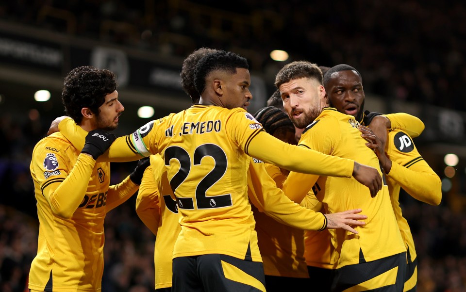WOLVERHAMPTON, ENGLAND - FEBRUARY 01: Jean-Ricner Bellegarde of Wolverhampton Wanderers celebrates scoring his team's first goal with teammates Nelson Semedo and Matt Doherty during the Premier League match between Wolverhampton Wanderers FC and Aston Villa FC at Molineux on February 01, 2025 in Wolverhampton, England. (Photo by Jack Thomas - WWFC/Wolves via Getty Images)