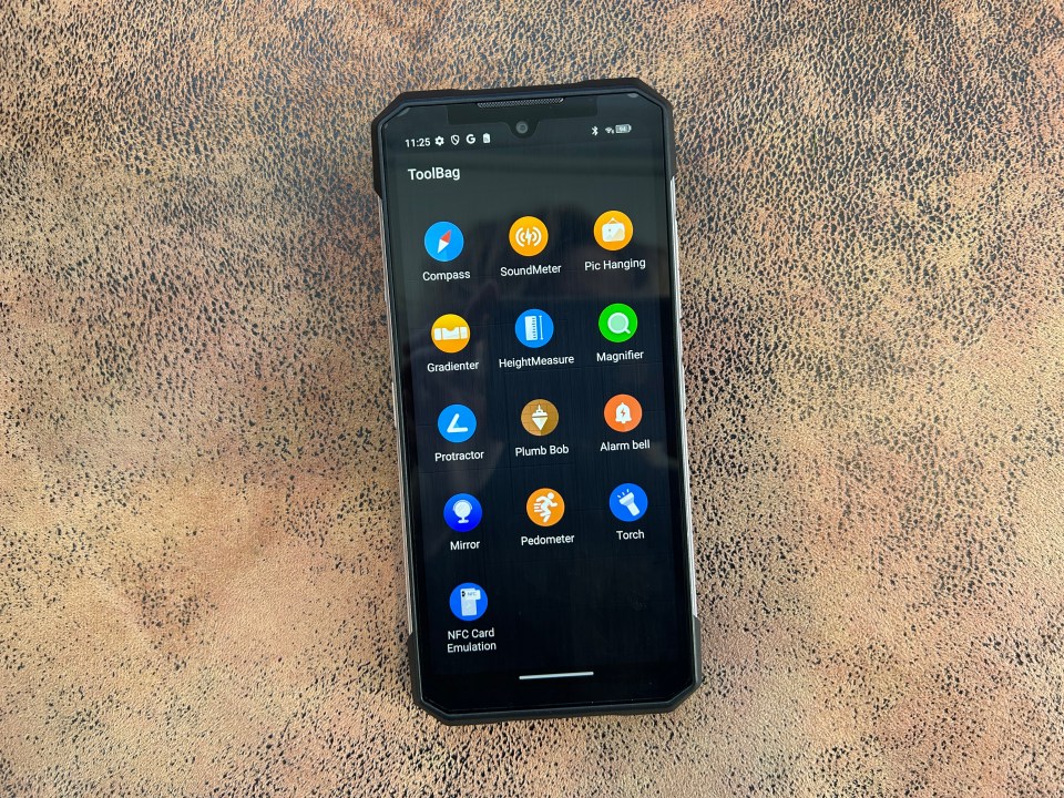 Smartphone displaying a toolbag app with various utility icons.
