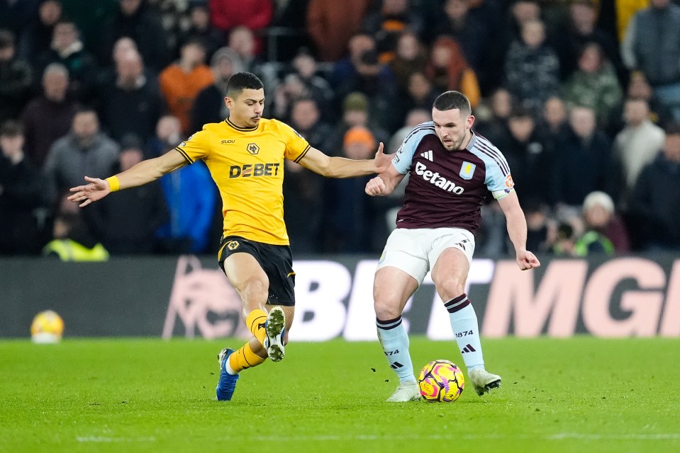 Aston Villa's John McGinn (right) and Wolverhampton Wanderers' Andre battle for the ball during the Premier League match at Molineux Stadium, Wolverhampton. Picture date: Saturday February 1, 2025. PA Photo. See PA story SOCCER Wolves. Photo credit should read: Nick Potts/PA Wire. RESTRICTIONS: EDITORIAL USE ONLY No use with unauthorised audio, video, data, fixture lists, club/league logos or "live" services. Online in-match use limited to 120 images, no video emulation. No use in betting, games or single club/league/player publications.