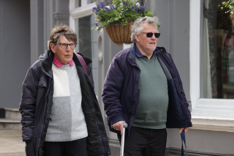 An elderly couple leaving Luton Crown Court.