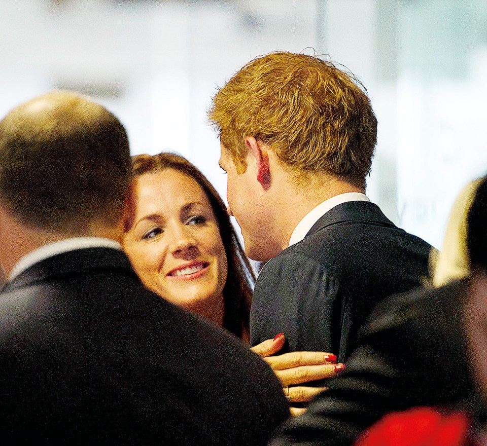 Prince Harry greeted by Natalie Pinkham at a charity event.