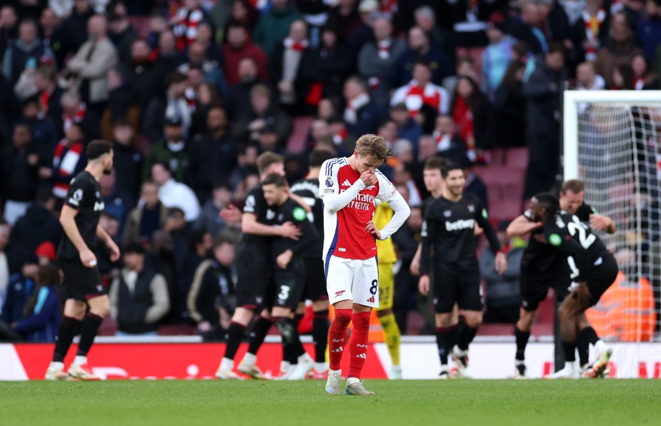Martin Odegaard of Arsenal looks dejected after a soccer match.