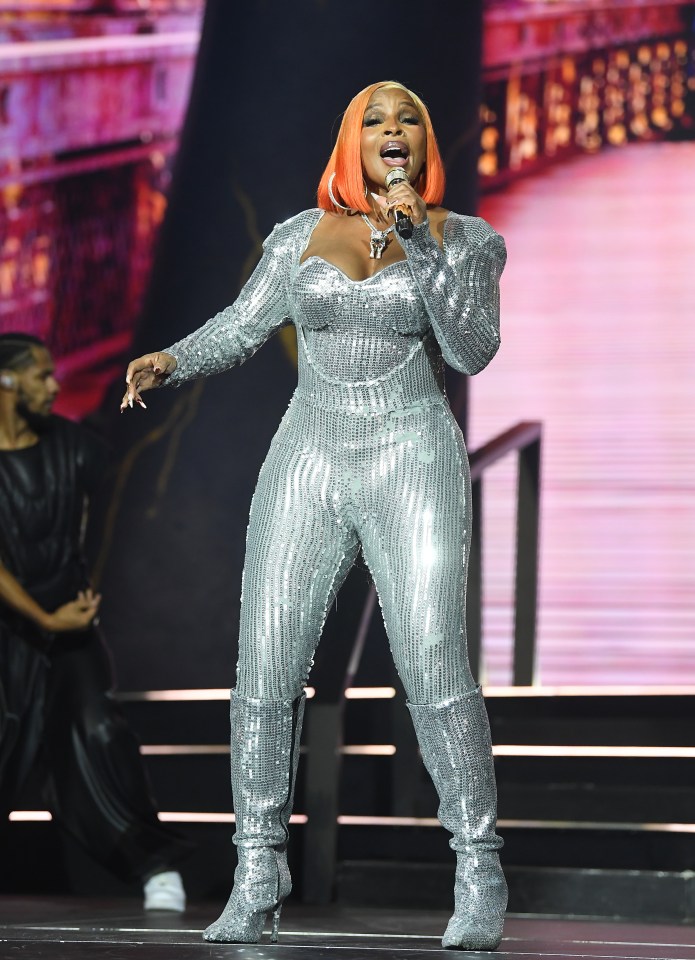 Mary J. Blige performing onstage.