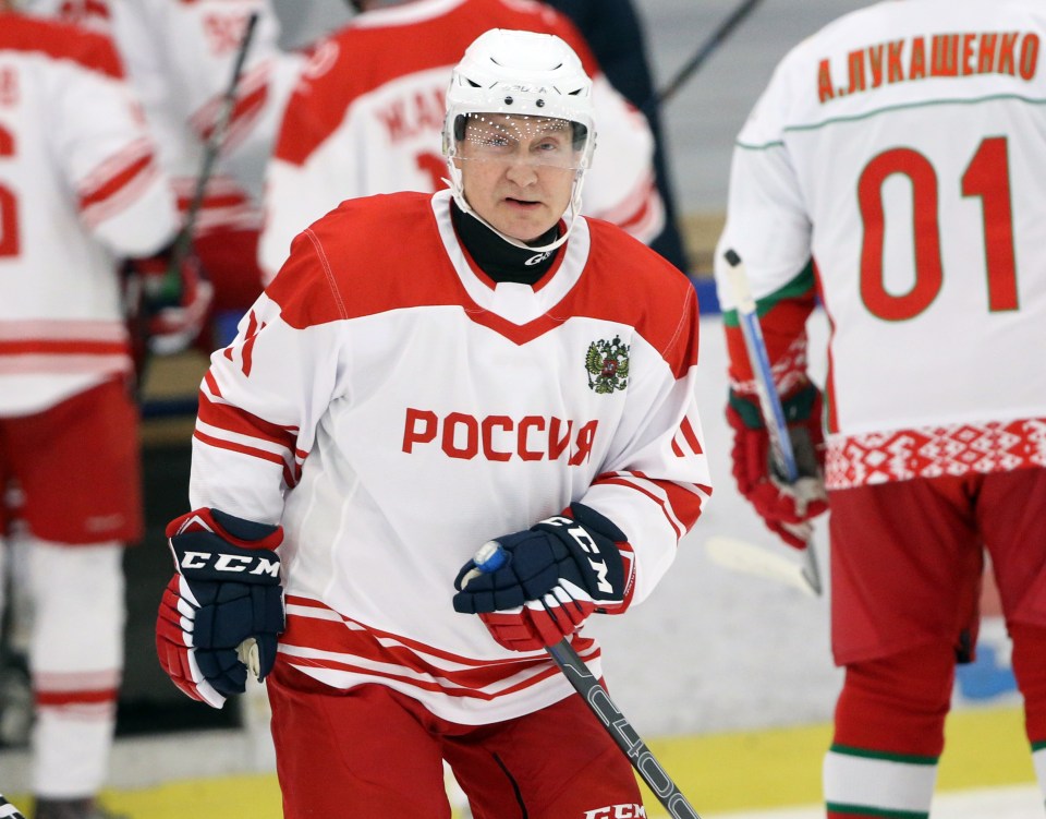 Vladimir Putin in a Russian ice hockey jersey.