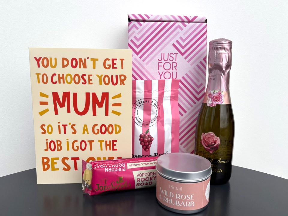 Mother's Day gift set with card, popcorn, candle, and mini bottle of Prosecco.