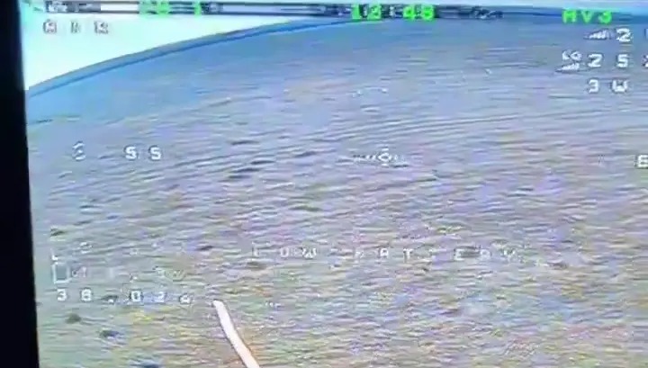 Screen capture of a drone strike on Russian soldiers riding e-scooters.