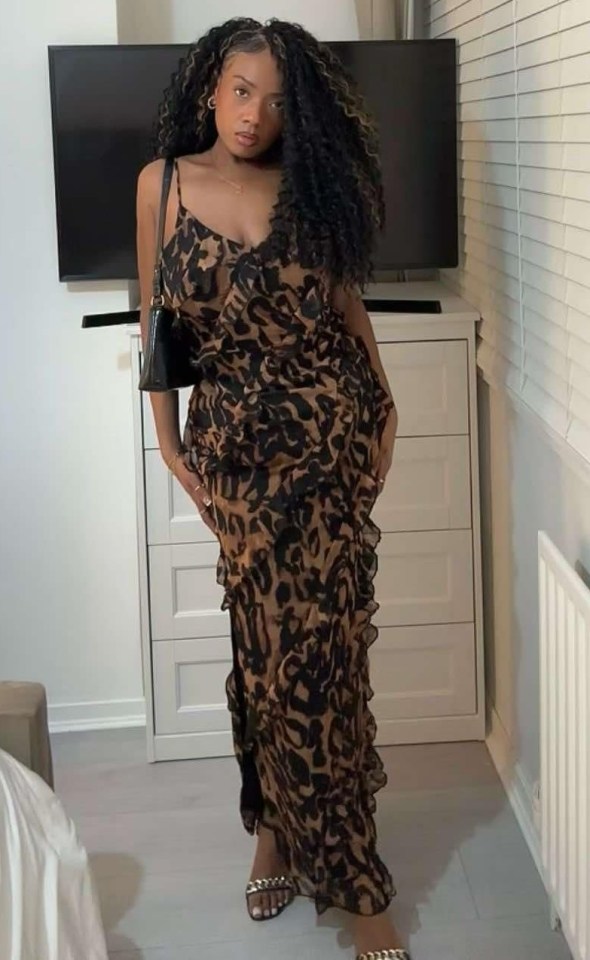 Woman in animal print dress.