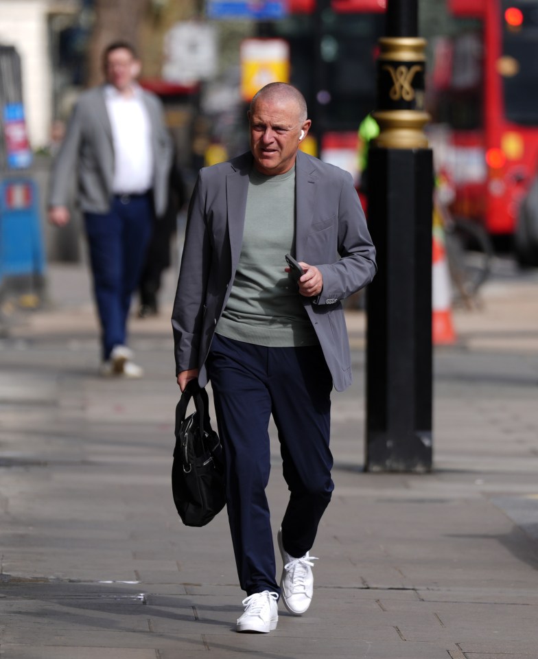Paul Barber, CEO of Brighton and Hove Albion, walking down a city street.