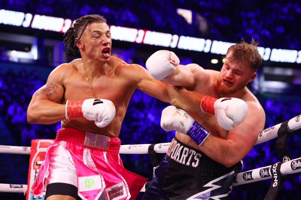 Boxers exchanging punches in a heavyweight fight.