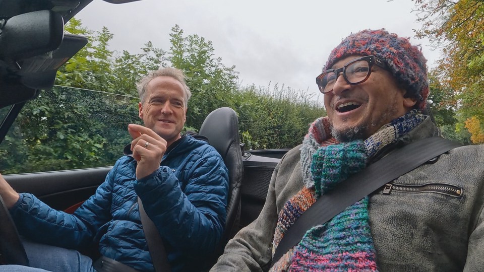 Fuzz Townshend and Tim Shaw in a convertible.