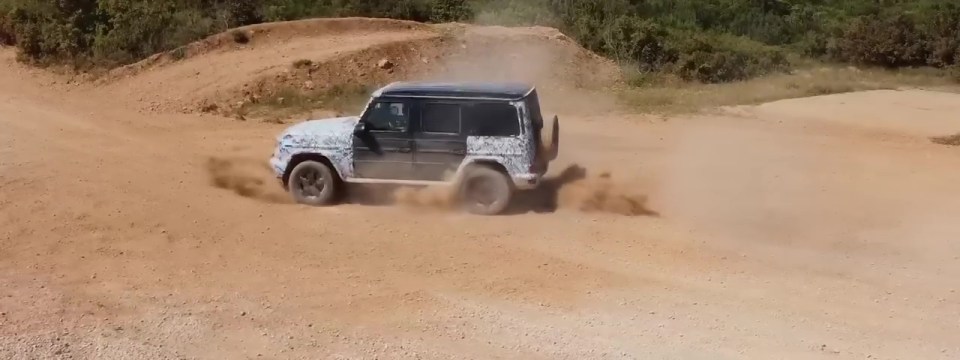 Mercedes EQG performing a G-turn on a dirt road.