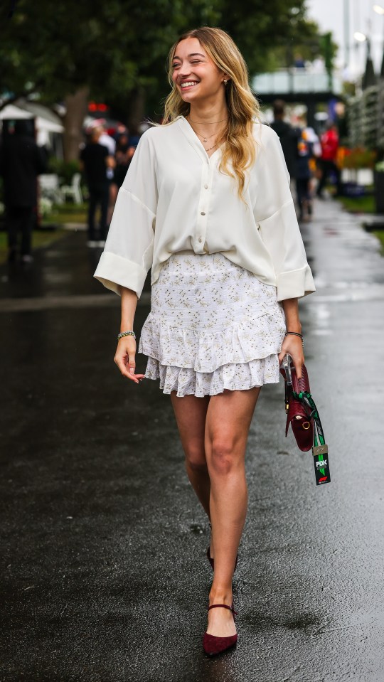 Isabella Bernardini, girlfriend of Gabriel Bortoleto, walking in the paddock.