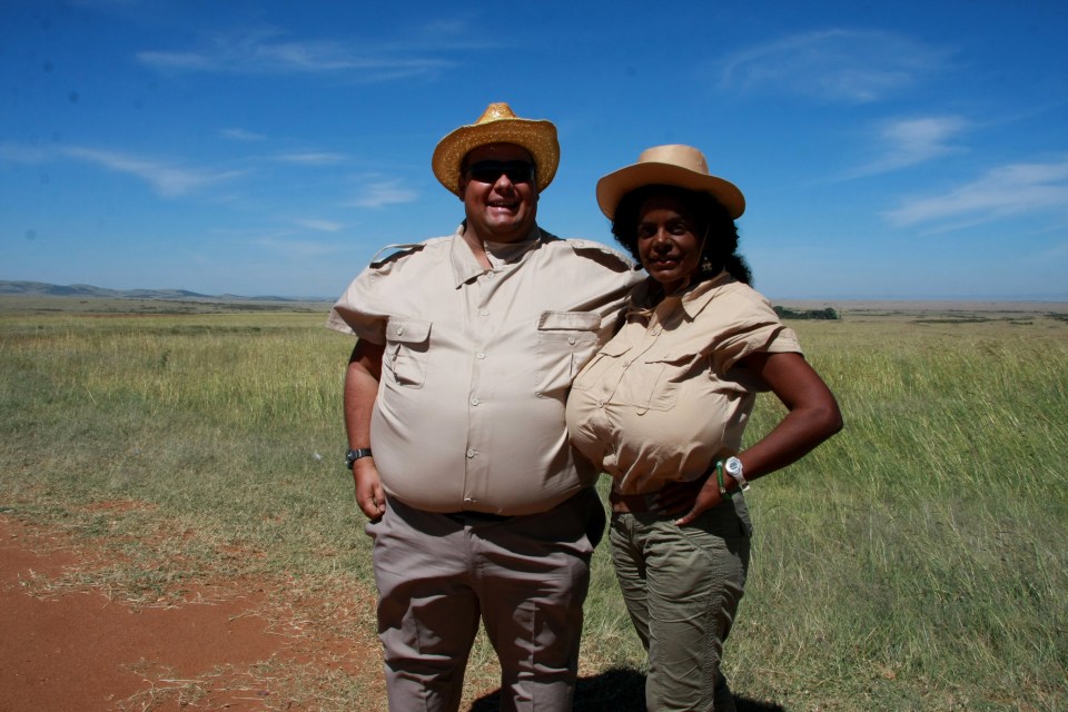 Martina Big and her husband Michael in a grassy field.