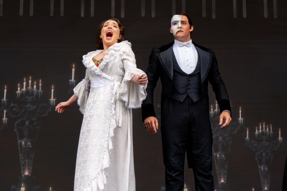 Cast members of The Phantom of the Opera performing on stage.