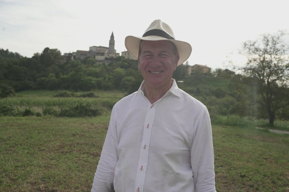Michael Portillo smiling outdoors.