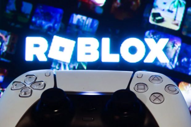 An image collage containing 1 images, Image 1 shows Illustration of a PlayStation 5 DualSense controller in front of a TV screen displaying the Roblox logo