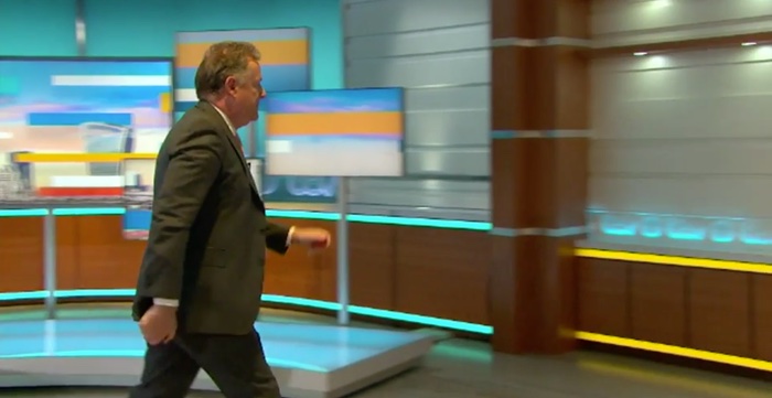 Piers Morgan walking off set.
