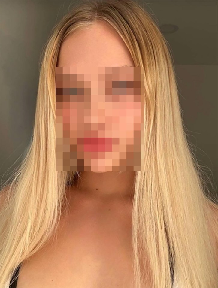 Woman with blonde hair wearing a white halter top.