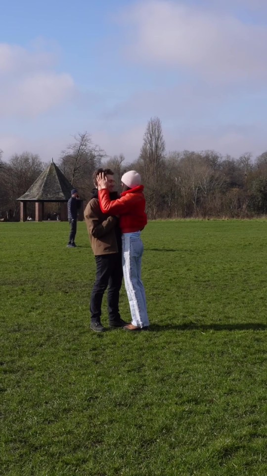 Couple embracing in a park.