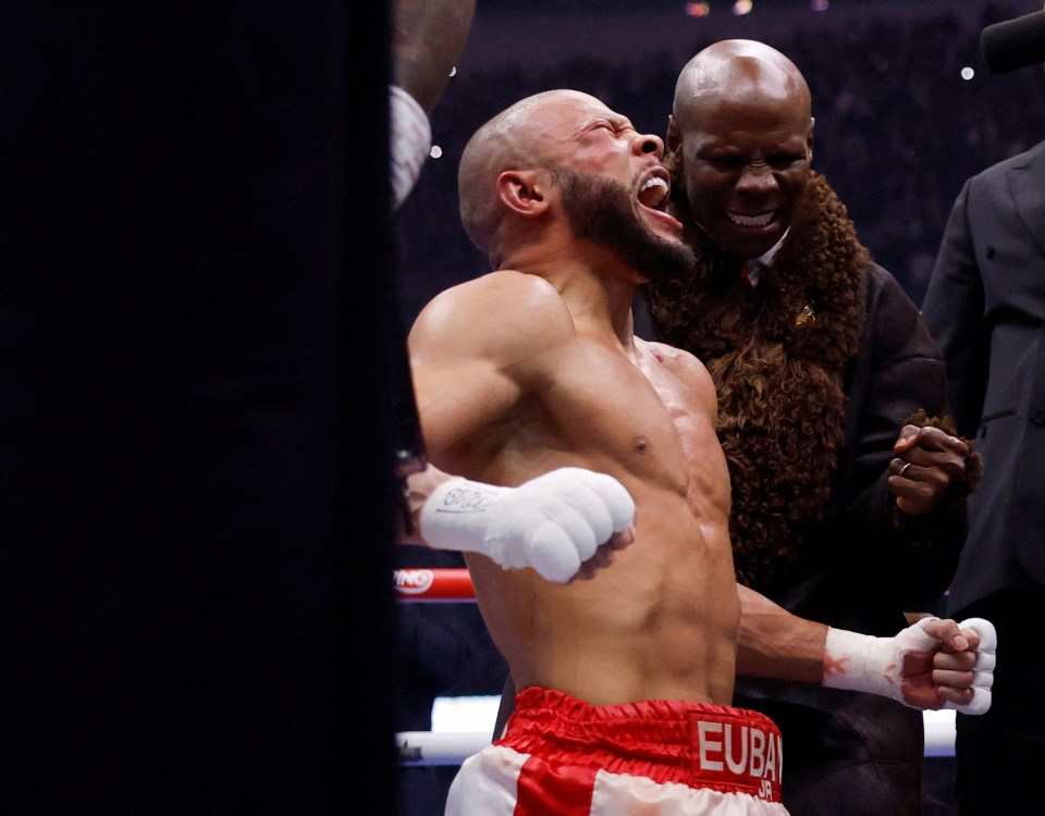 Chris Eubank Jr. celebrating a boxing victory with his father.