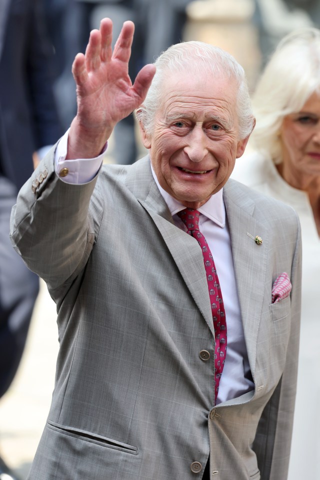 King Charles III waving during a visit to Italy.