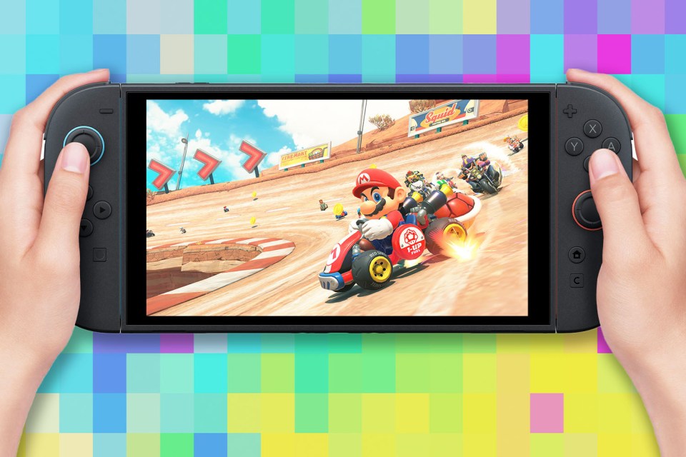 Hands holding a Nintendo Switch playing Mario Kart.