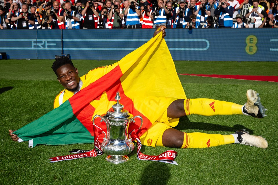 Andre Onana of Manchester United celebrating with the FA Cup trophy.