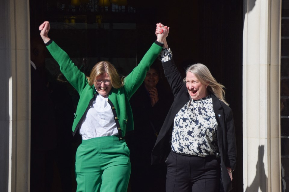 Two women celebrating outside the Supreme Court.