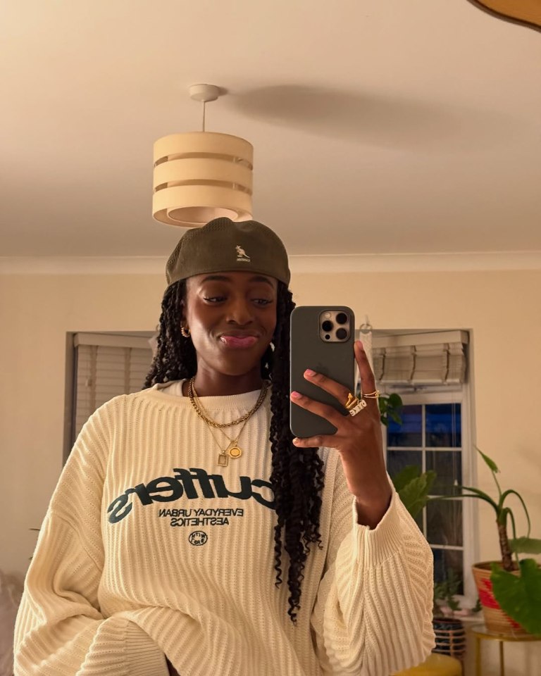 Cat Burns, British singer-songwriter, taking a selfie.