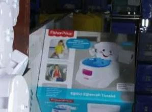 Fisher-Price potty training toilet in its box.