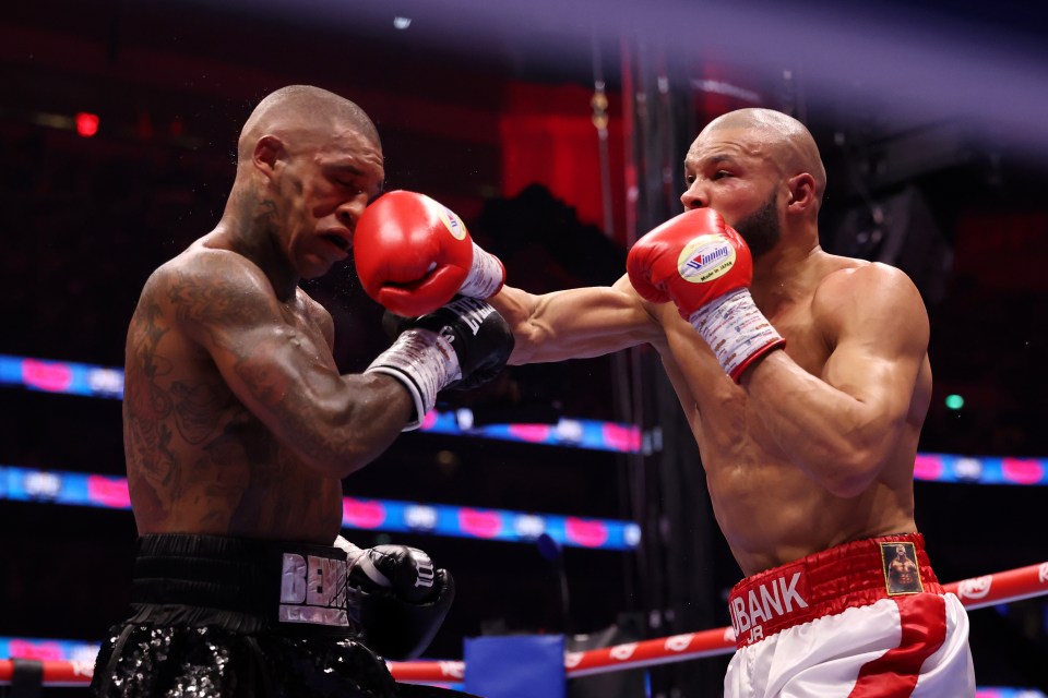 Chris Eubank Jr. punches Conor Benn during a boxing match.