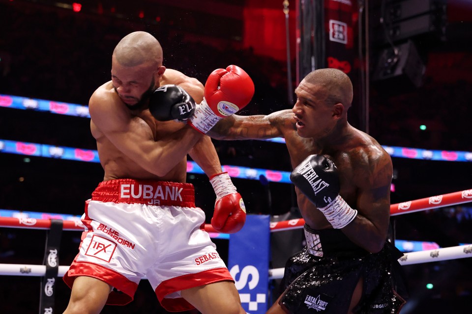 Conor Benn punches Chris Eubank Jr. in a boxing match.