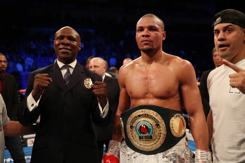 Chris Eubank Jr. with his father and the IBO World Super-Middleweight Championship belt.