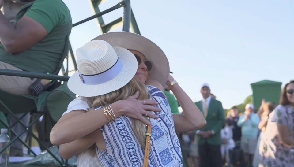 Two women hugging.