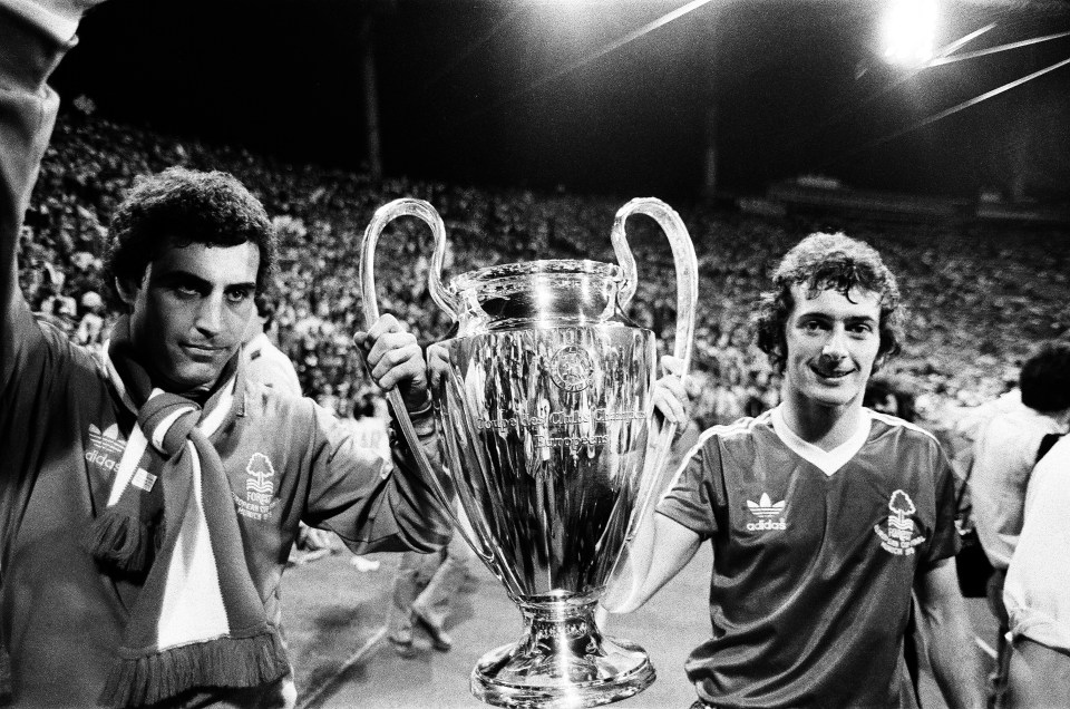 Black and white photo of Nottingham Forest players Peter Shilton and Trevor Francis holding the European Cup trophy after winning the 1979 final.