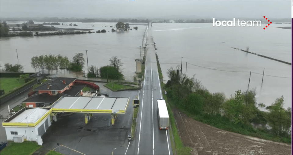 Flooded road and gas station in Italy.