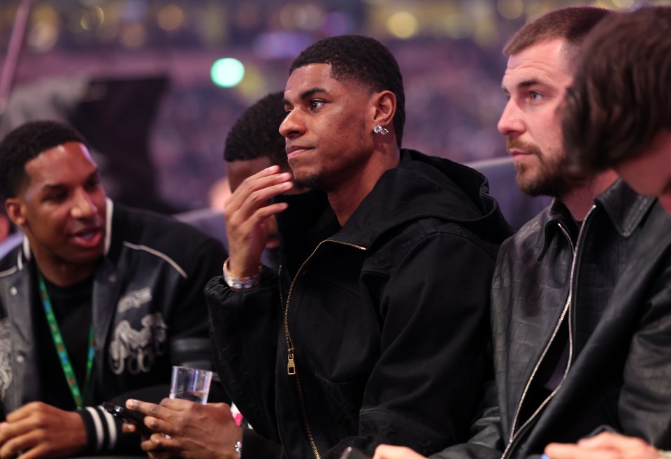 Marcus Rashford watching a boxing match.