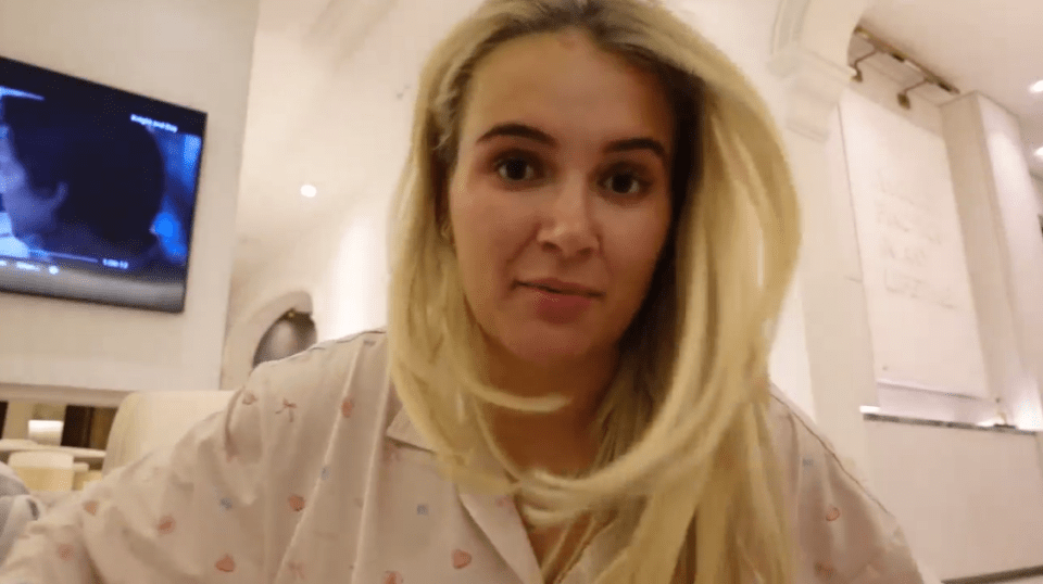 Woman with blonde hair speaking to camera.
