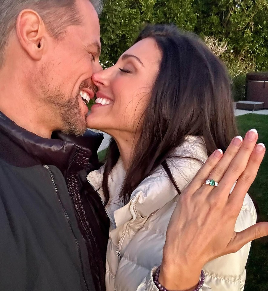 Ioan Gruffudd and Bianca Wallace engaged, showing engagement ring.