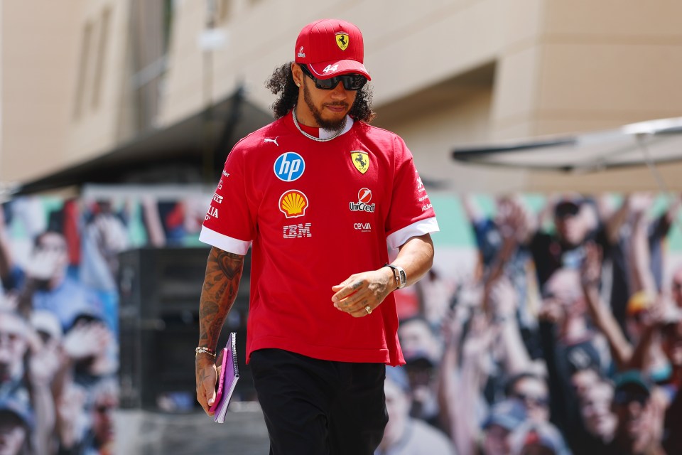 Lewis Hamilton walking in the paddock.