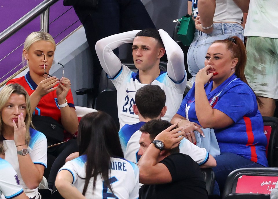 Phil Foden with his mother and girlfriend at a FIFA World Cup match.