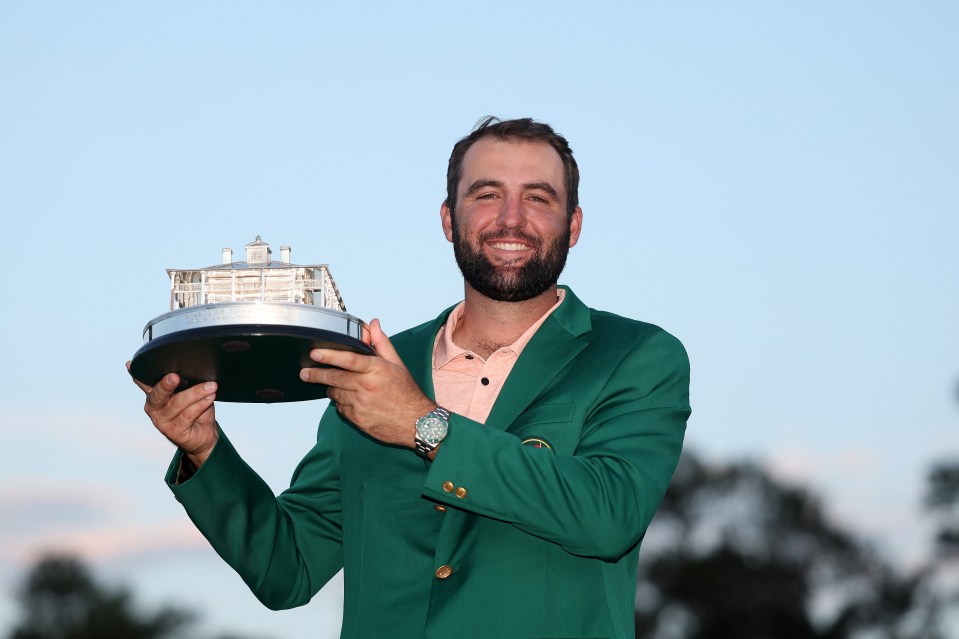 Scottie Scheffler holding the Masters trophy.