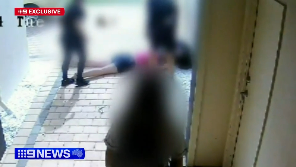 Security footage of two women fighting.
